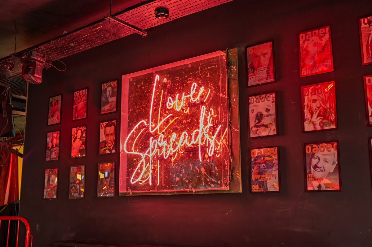 Neon signage on the newspaper wall